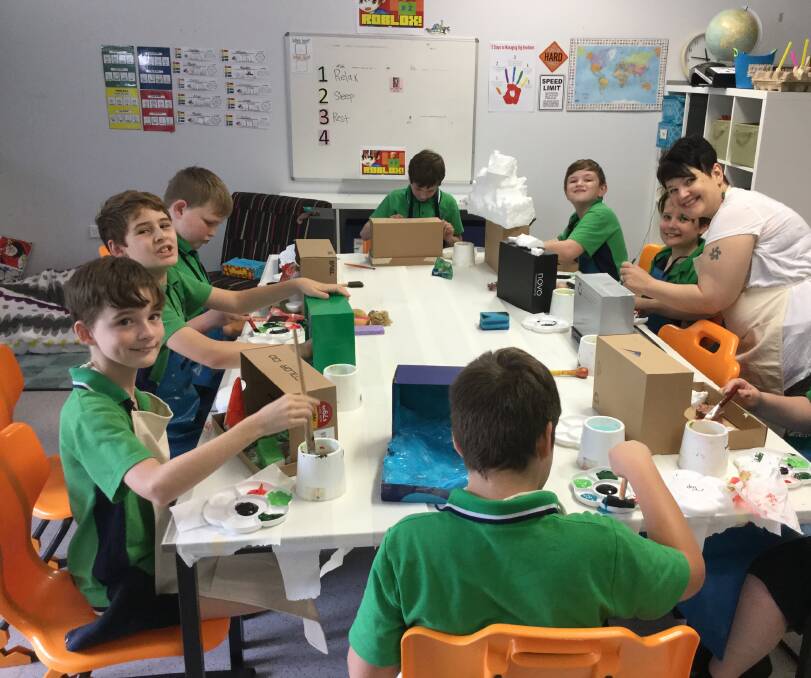 BEING CREATIVE: Teacher Lucy Brown with year 5 students.