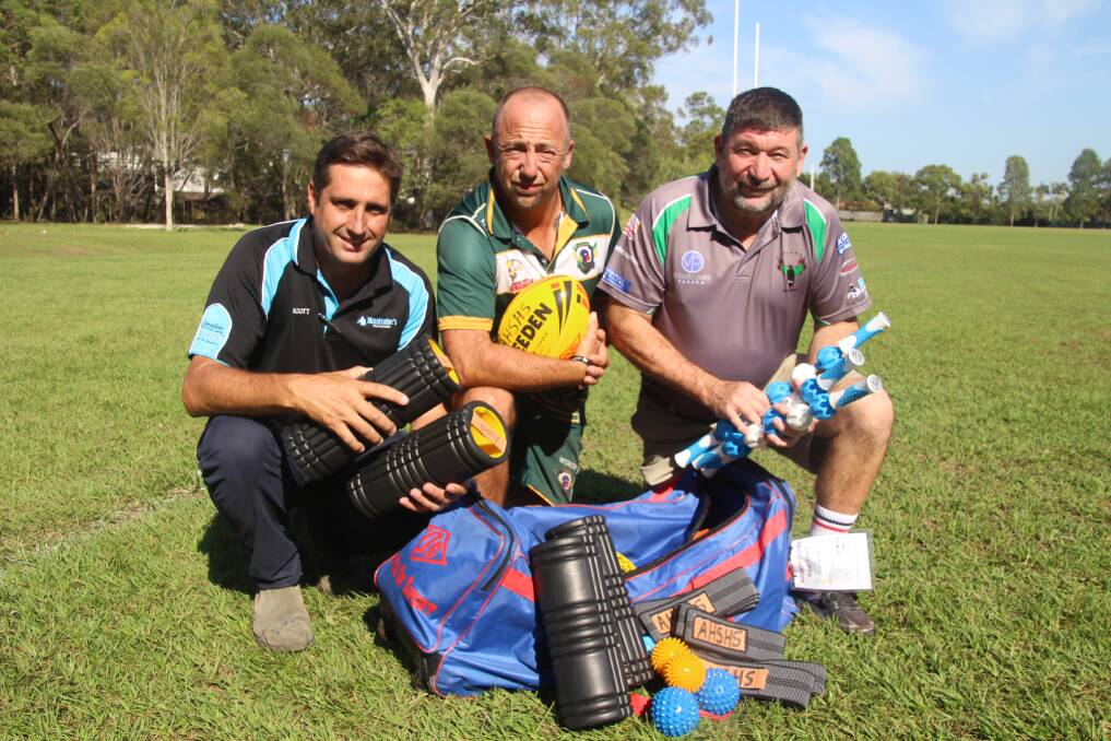 SUPPORTERS: Redlands Rugby League Old Boys sponsor Scott Stitcher from Mandrakes Paint and Panel (left) and treasurer Gavin O'Brien (right) with Alexandra Hills State High School rugby league co-ordinator Darren Johnston with the rehabilitation equipment bought by the Old Boys.