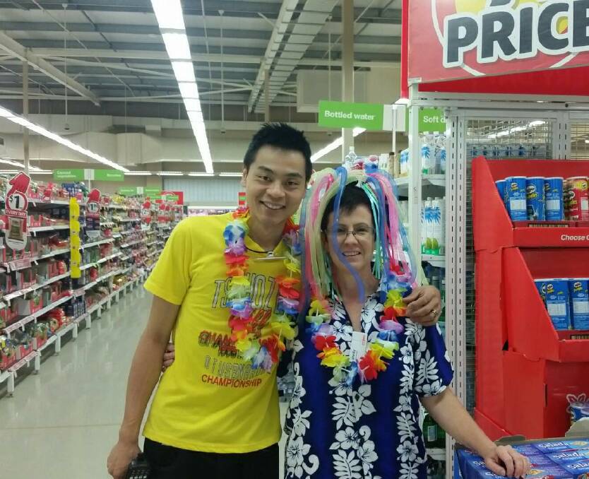FUNDRAISING: Allen Lu and store manager Shelly Underwood encourage customers to donate money as part of the Ovarian Cancer Australia campaign. Photo: Supplied