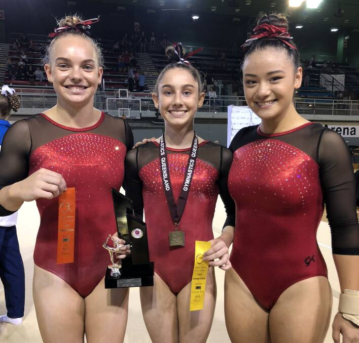 STATE EVENT: Marsali Andrews, Jayde Beutel and Stephanie Zeilinga at the Queensland women's artistic gymnastics championships.