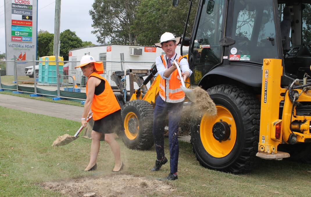 WORK STARTS: Redlands MP Kim Richards and Transport Minister Mark Bailey turn the first sod as work gets under way at the site of the Victoria Point Central bus station. Photo: Cheryl Goodenough
