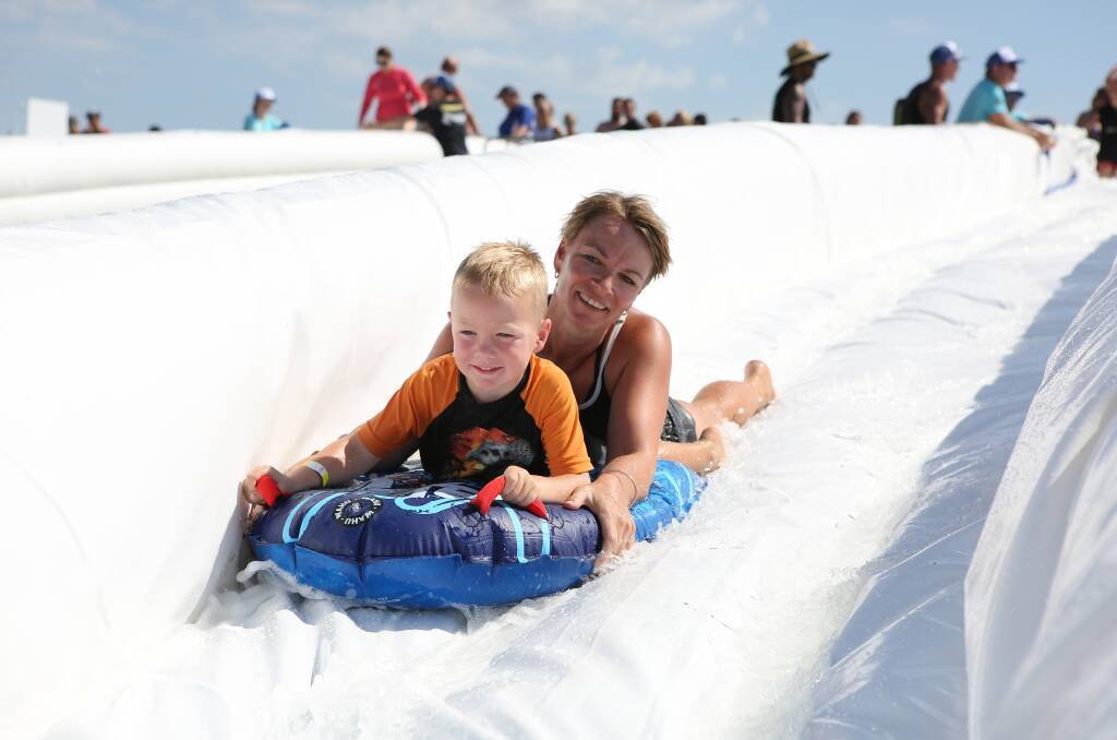 WATER FUN: The Slideapalooza event provides more than 2000 metres of inflatable water slides for participants to enjoy.