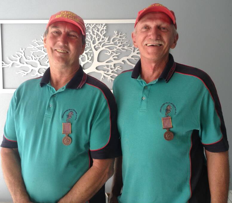 RECOGNISED: Colin Sloan and Russell Rubie have received National Medals in recognition of their efforts for the Coochiemudlo Island Surf Life Saving Club.