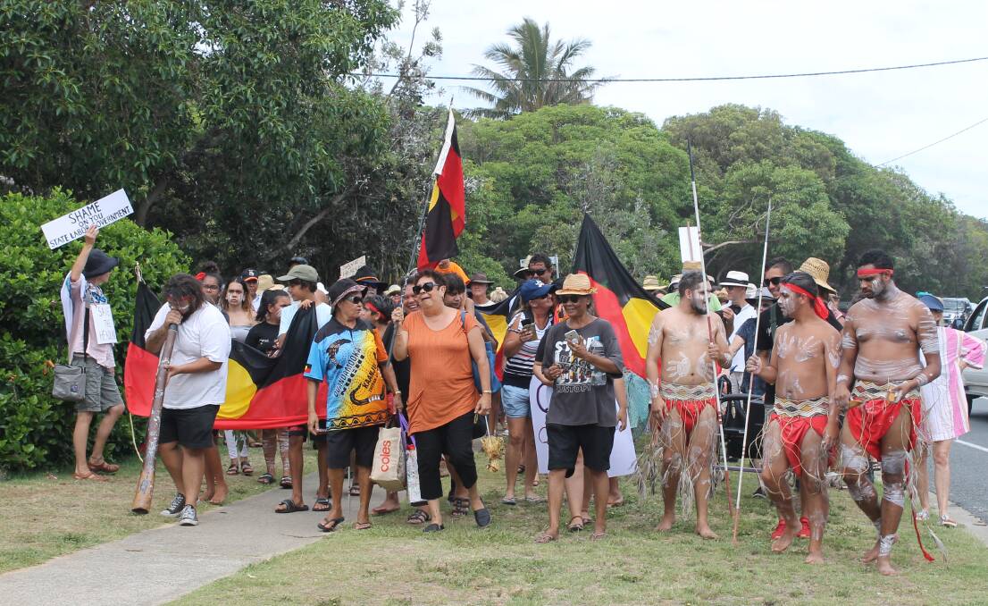 MARCH UNDER WAY: Protesters march towards the headland where the Quandamooka Yoolooburrabee Aboriginal Corporation and state government plan to put a whale facility. Photo: Cheryl Goodenough