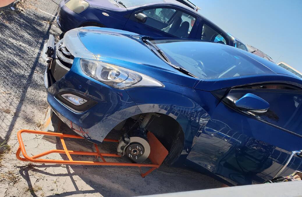STOLEN: All four wheels were stolen off this car parked at Weinam Creek marina car park at Redland Bay on the weekend.