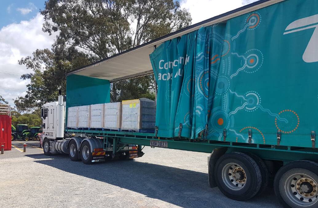 TRUCKING IN WATER: Bottled water being transported to Macleay, Lamb and Karragarra islands.