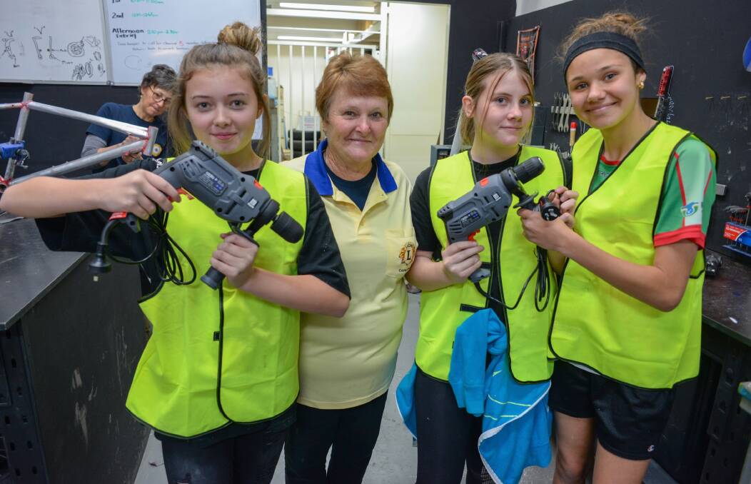 STUDENTS: President of the Lions Club of Capalaba Janet Bastin (second from left), with students Kiana Avery, Holly McGovern and Jayde Wildermoth. Photo: Supplied