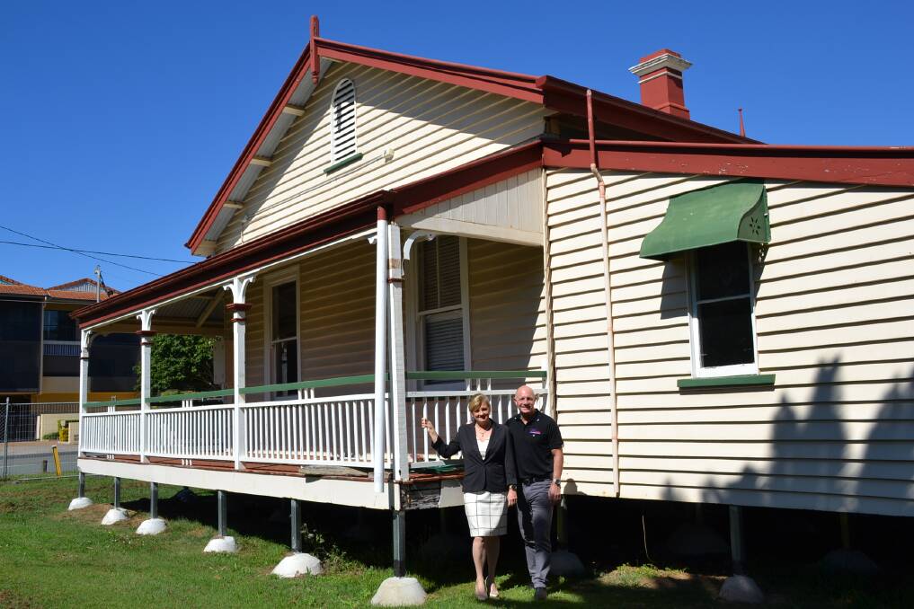 THE COTTAGE: Mayor Karen Williams and Cr Peter Mitchell outside the historic Station Masters Cottage after it was moved to Little Shore Street.