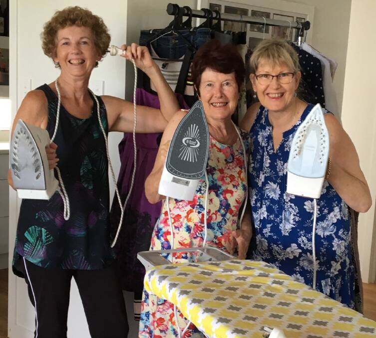 FASHION FAIR PREP: The irons are running hot ahead of the Here’s to Life Recycled Fashion Fair on Saturday. Pictured are Christine Hammond, Gillian Lock and Therese Paterson.