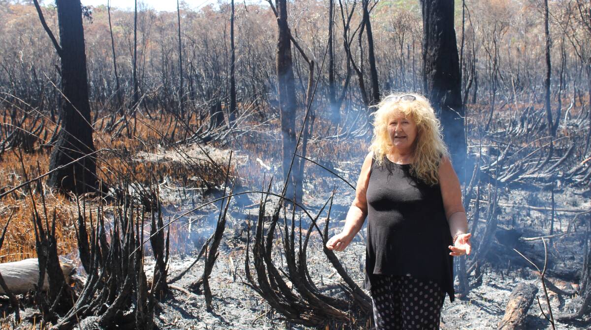 SMOULDERING FIRES: Russell Island resident Sharon Keegan said she saw a man leave the scene of last week's fires on a trail bike. Photo: Cheryl Goodenough