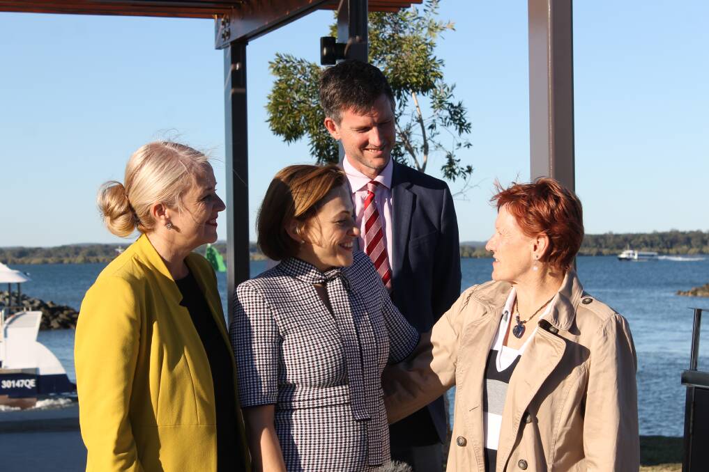 AT REDLAND BAY: Redlands MP Kim Richards, Treasurer Jackie Trad and Transport Minister Mark Bailey chat to Lamb Island resident Dianne Eddy. Photo: Cheryl Goodenough