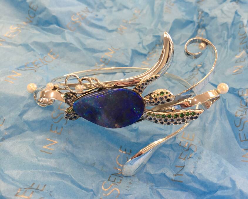ANGELA'S DESIGN: Angela Hampton's piece Paradise Blue features a Queensland boulder opal, sapphires and tsavorite garnets.