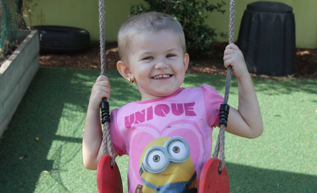 STILL SMILING: Three-year-old Lilly Antonelli, of Redland Bay, is being support by family, friends and her kindy after being diagnosed with a rare chronic brain disease. Photo: Cheryl Goodenough