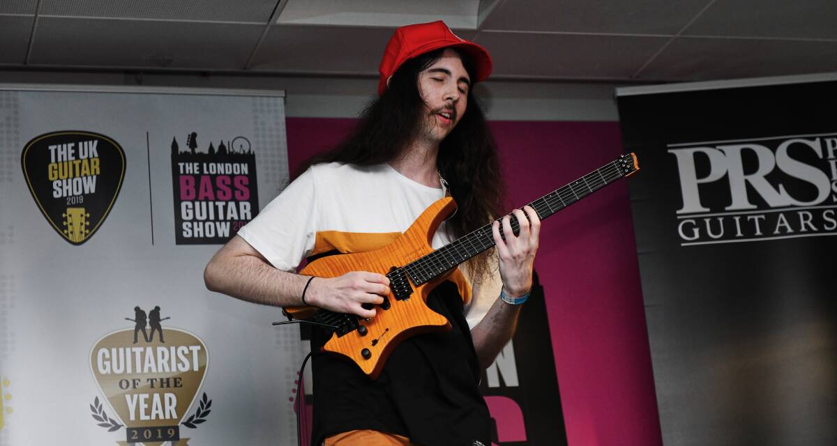 PERFORMING: Dylan Reavey performs in the UK Guitar Show's Guitarist of the Year competition.