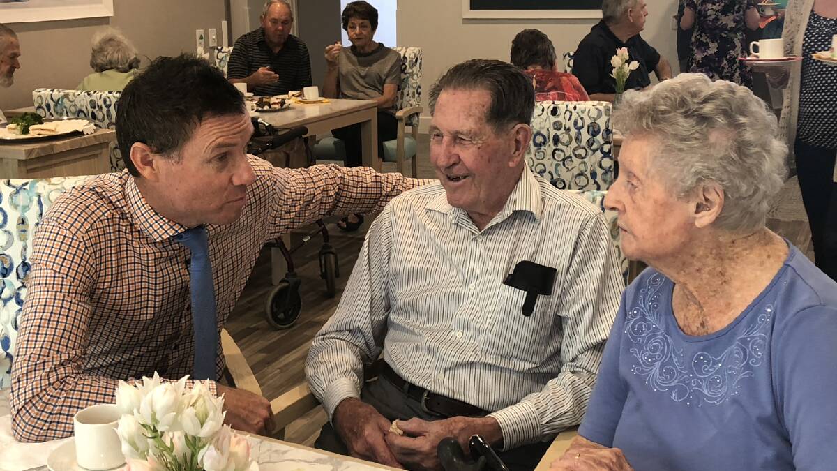 OPENING: Federal MP Andrew Laming talks to Moreton Shores residents Don and Joan Campbell.