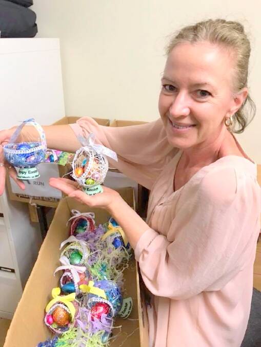 SPECIAL GESTURE: Cleveland Meals on Wheels co-ordinator Maree Smith with some of the Easter baskets.