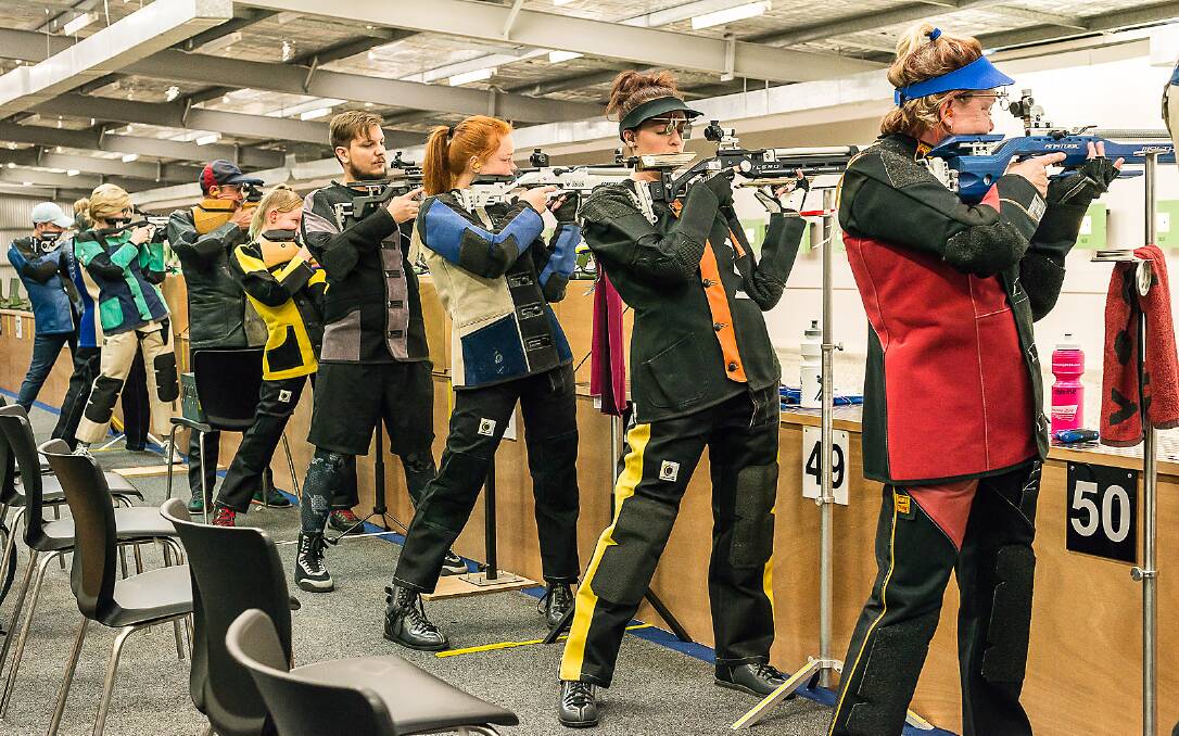 COMPETING: Alyce Gallon (second from right) competes in the qualification round of the 10 metre air rifle state championship event. Photo: Yvonne Hill