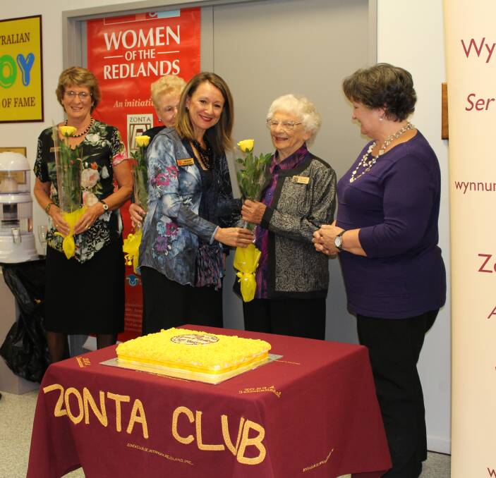 HONOURING MEMBERS: District Governor Ansmarie Van Erp presents foundation member Phyllis Pledger with a Zonta yellow rose marking 35 years of service and advocacy in the Redlands.