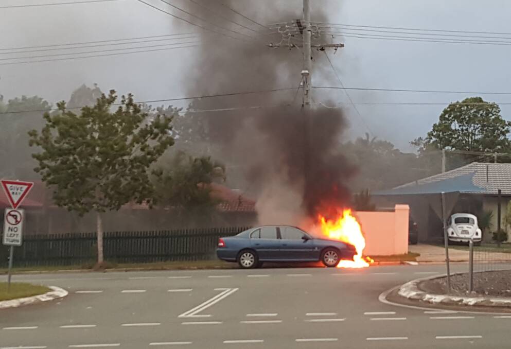A Holden Commodore on fire in Vienna Road on Tuesday. Photo: Matt Goode