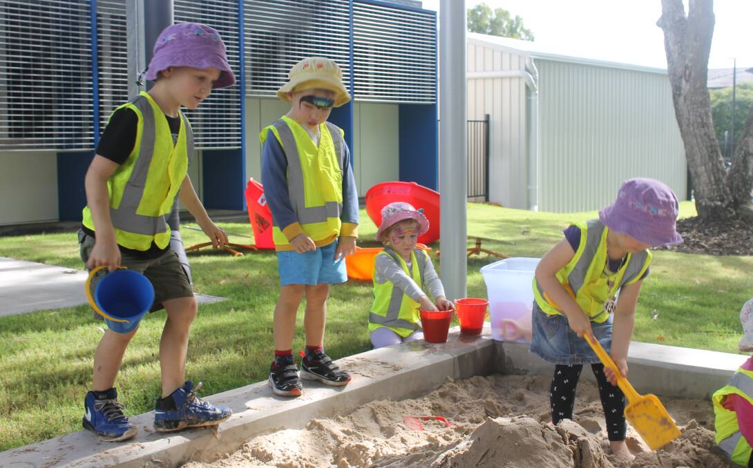 Children play in the sand pit at the community and family hub at Capalaba.