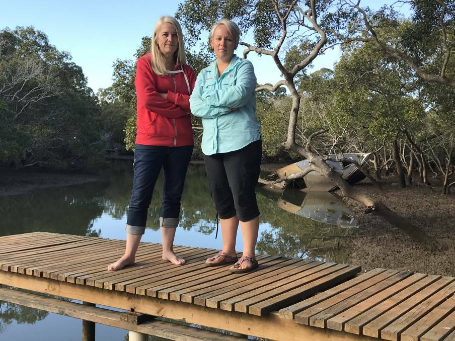 TASKFORCE: Redlands MP Kim Richards, pictured with kayaker Katrina Beutel, will lead a taskforce to deal with derelict boats in waterways.