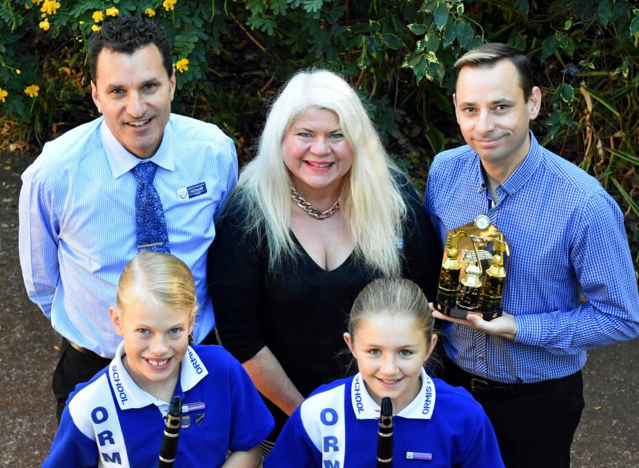 MUSIC ACHIEVEMENTS: Ormiston State School principal Neil Randall, conductors Elizabeth Patterson and Thomas Melton and cultural captains Anna Crooke and Lily Shannon. Photo: Supplied