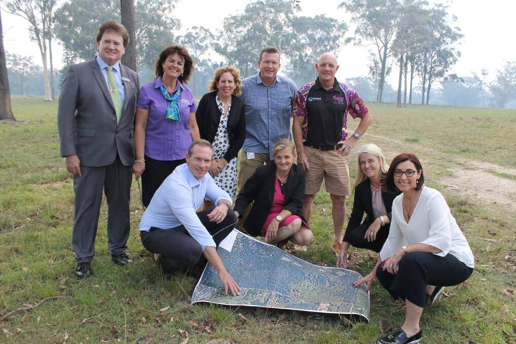 ON THE LAND: Sport Minister Mick de Brenni (front) with Redland mayor Karen Williams and Redlands MP Kim Richards and Cr Julie Talty and (back) councillors Lance Hewlett, Wendy Boglary, Tracey Huges, Paul Golle and Peter Mitchell. Photo: Cheryl Goodenough