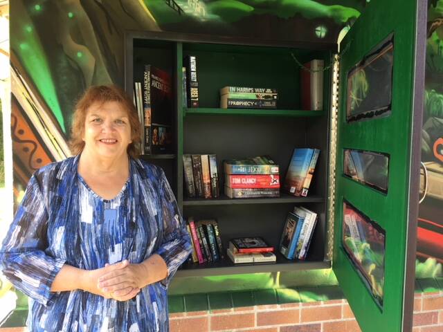 LIBRARY: Alexandra Hills resident Edna Searle had the idea for a community library which has been incorporated into street art at a Wellington Point park.