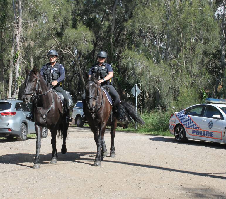 MOUNTED: Police officers from the mounted unit arrive at Geoff Skinner Wetlands to help with the search for Wellington Point man Keith Newton. Photo: Cheryl Goodenough