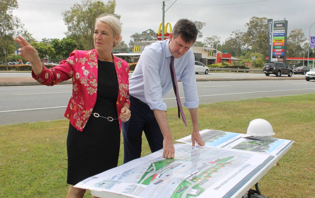 VICTORIA POINT: Redlands MP Kim Richards and Transport Minister Mark Bailey look at designs for the Victoria Point Central bus station. Photo: Cheryl Goodenough