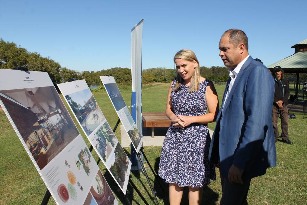VIEWING PLANS: Tourism Industry Minister Kate Jones and Quandamooka Yoolooburrabee Aboriginal Corporation chief executive Cameron Costello look at plans for the centre. Photo: Cheryl Goodenough