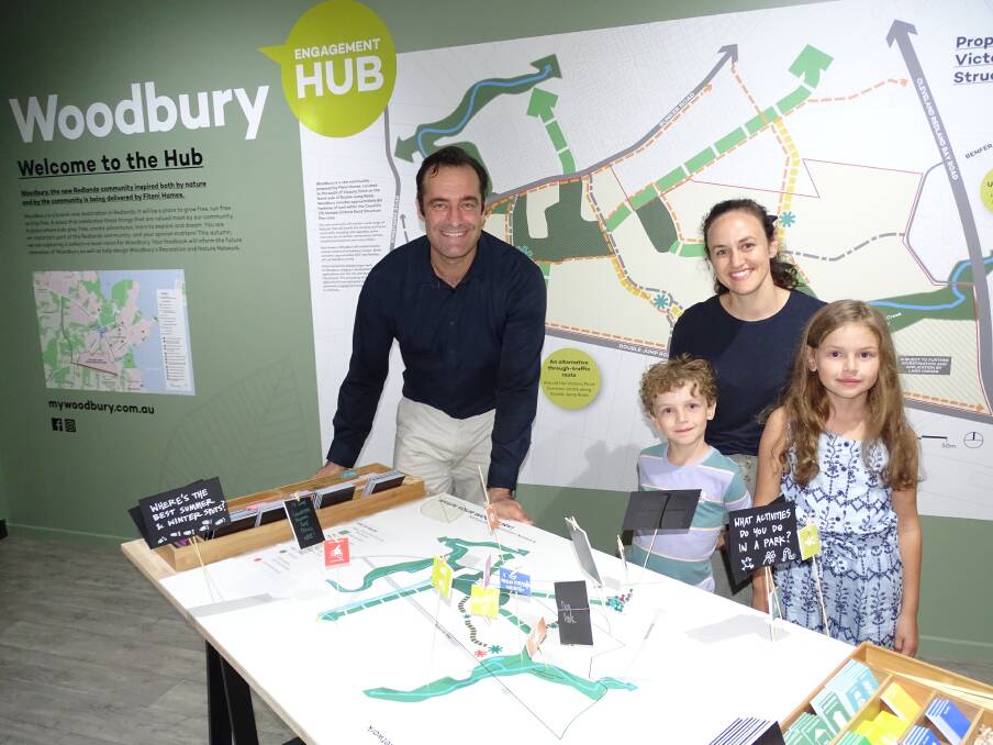 WOODBURY: Fiteni Homes manager Vaughn Bowden chats to Emmalee Fell and her children about Woodbury.
