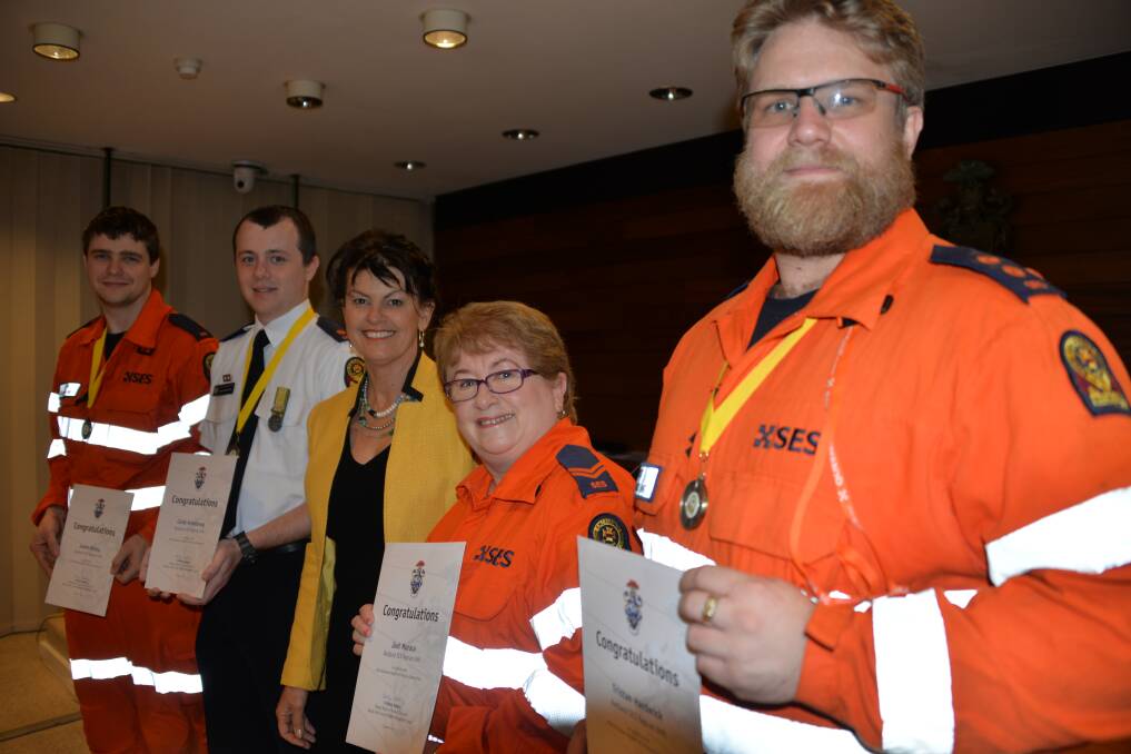 RECOGNISED: Redlands SES rescue team members Justin Kirby, Corey Armstrong, Jenny Brown and Tristan Hardwick, with Acting Mayor Wendy Boglary.