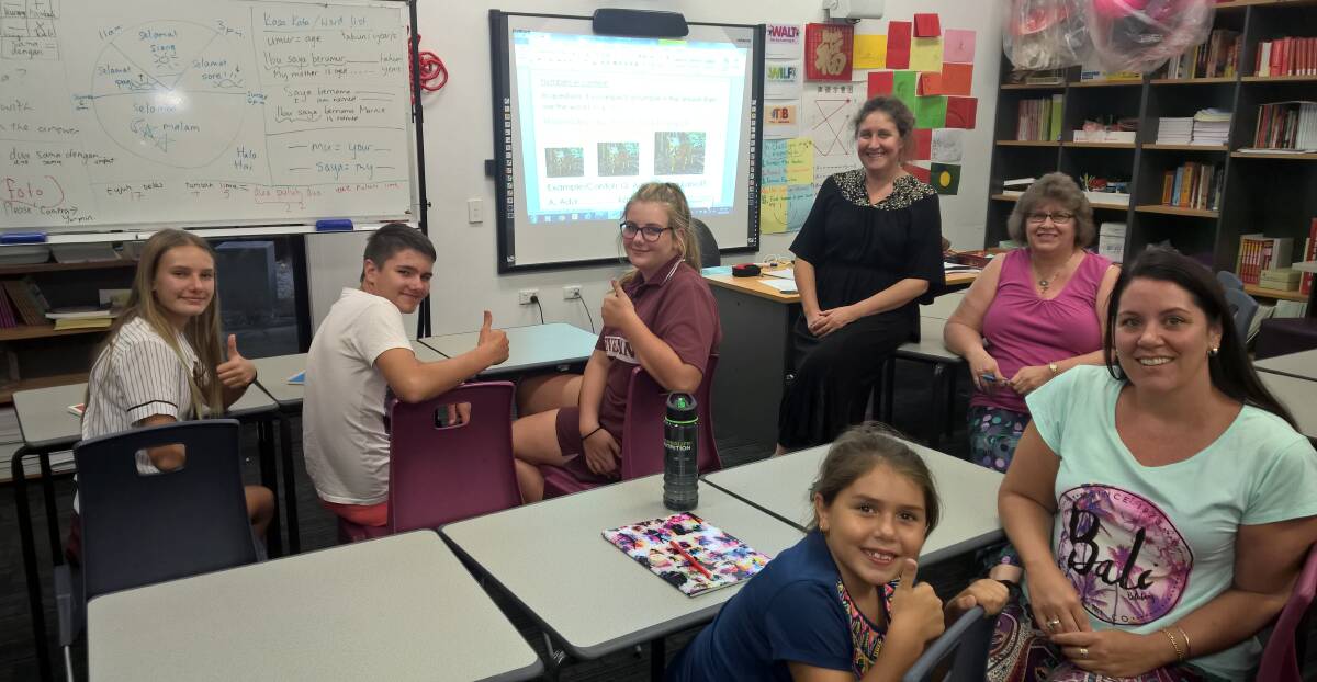 INDONESIAN CLASS: Cleveland District State High School students Hannah Sharp, Jacob Brown and Lauren Sinnet, with Indonesian teacher Nicola Hight (wearing black), Jeanette King, and (in front) mother and daughter Marnie and Angelina Davis.