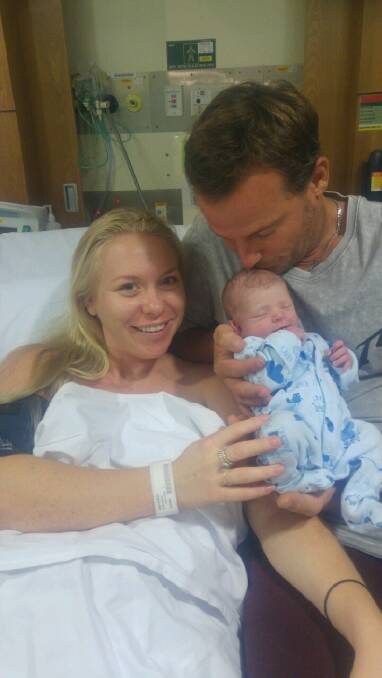 First-time parents Alisha Stevenson and Adam Gould with baby Archie. Photo: Supplied