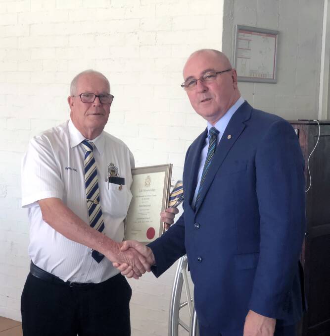 RECOGNITION: Redland RSL Sub-Branch president Alan Harcourt receives his life membership from RSL Queensland state president Tony Ferris.