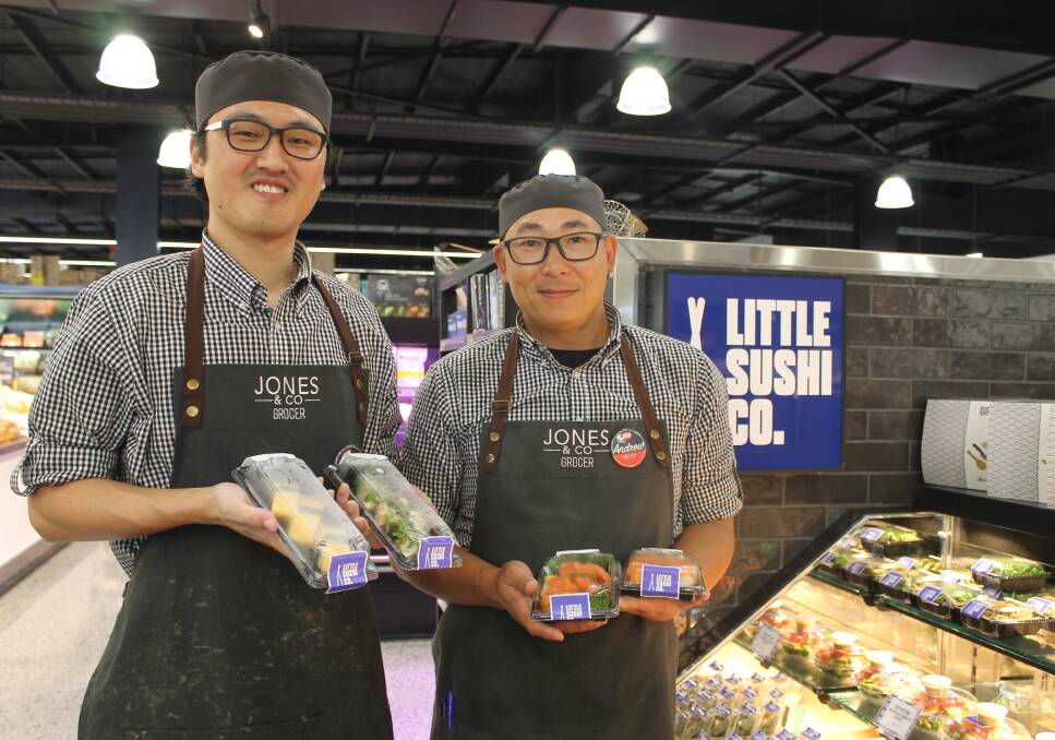 AT WORK: Sushi chefs Jongmo Yoo and Andrew Tanudjaja with some of the sushi prepared in store. Photo: Cheryl Goodenough