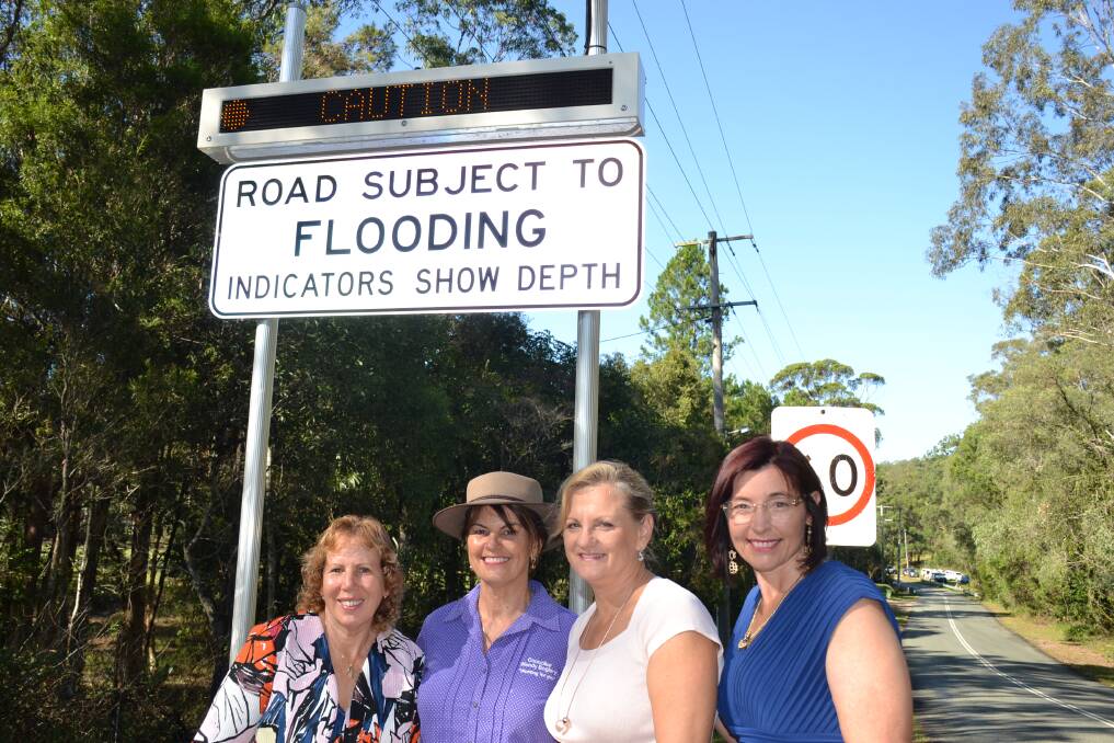 Caption: Crs Tracey Huges, Wendy Boglary, Karen Williams and Julie Talty inspect the newly installed illuminated automated flooded road signs at Avalon Road, Sheldon.