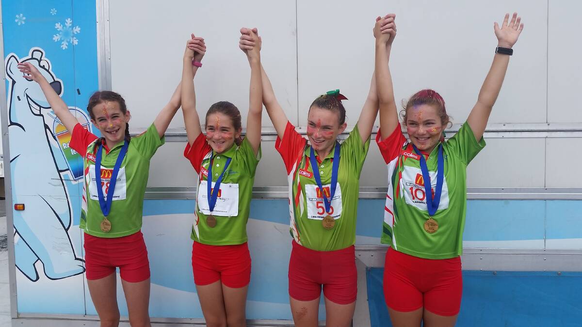 RECORD BREAKERS: The under 12 girls medley relay team of Chloe Michell, Daniela Hankey, Anika Clarke and Molly Degraaf celebrate their new records. Photo: Supplied