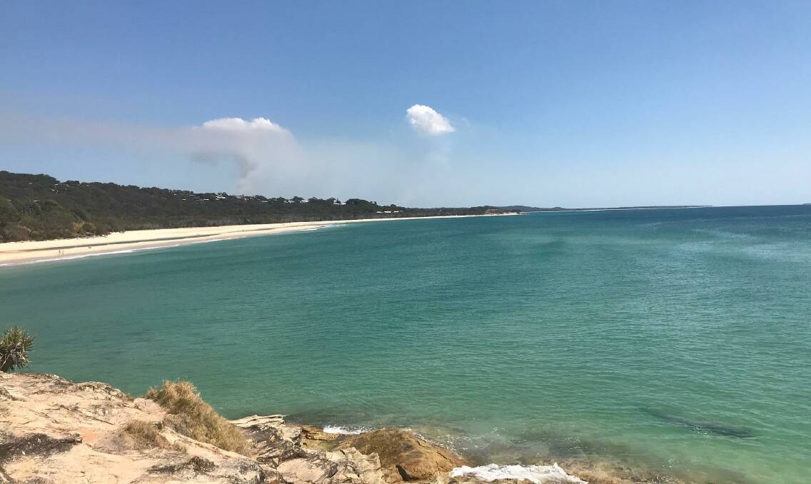 STRADDIE: The view from Point Lookout on North Stradbroke Island while a fire burns near Amity Point. Photo: Redland City Council