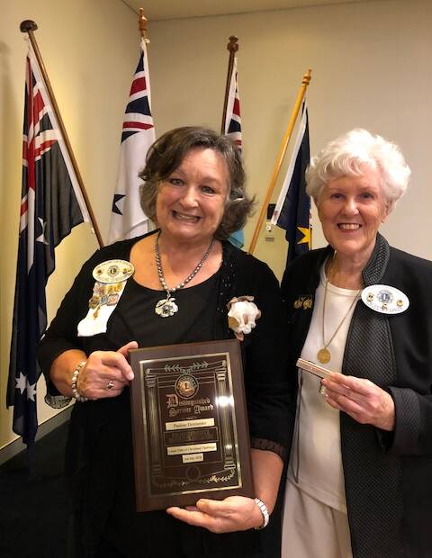 PAYING TRIBUTE: Immediate past president Pauline Denisenko receives the Distinguished Service Award from charter president Celeste Parker.