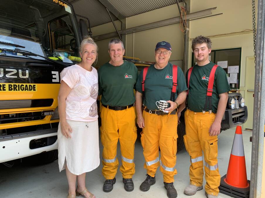 FIRIES: Member for Redlands Kim Richards with members of the Russell Island Rural Fire Brigade team.
