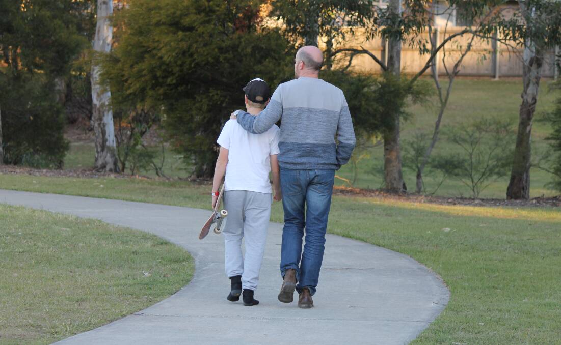 THORNLANDS: Joseph and his father Geoff Helmrich on the walkway at William Stewart Park, Thornlands. Photo: Cheryl Goodenough
