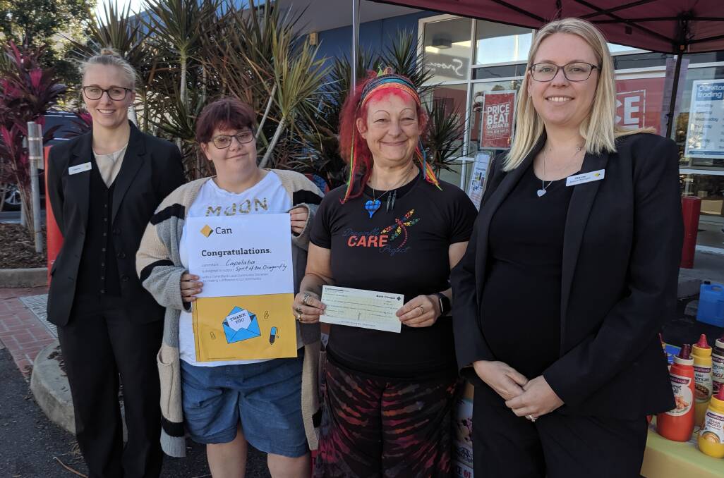 HANDOVER: Commbank Capalaba's Lauren Medill and branch manager Stacey Tripp (right) with Emily Williams and Lisa-Jane Luck, both from Spirit of the Dragonfly.
