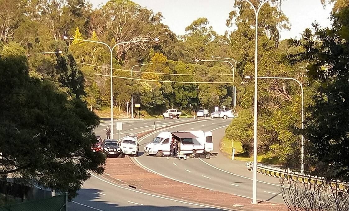 INVESTIGATION: Specialist police officers investigate a suspicious item at Capalaba on Tuesday afternoon. Photo: Helen Duggan