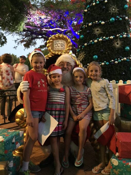 CLEVELAND: Nine-year-old Lily, Seonaid, 7, Amelie, 5, and Zoe Harkins, 5, welcome Santa to Cleveland.
