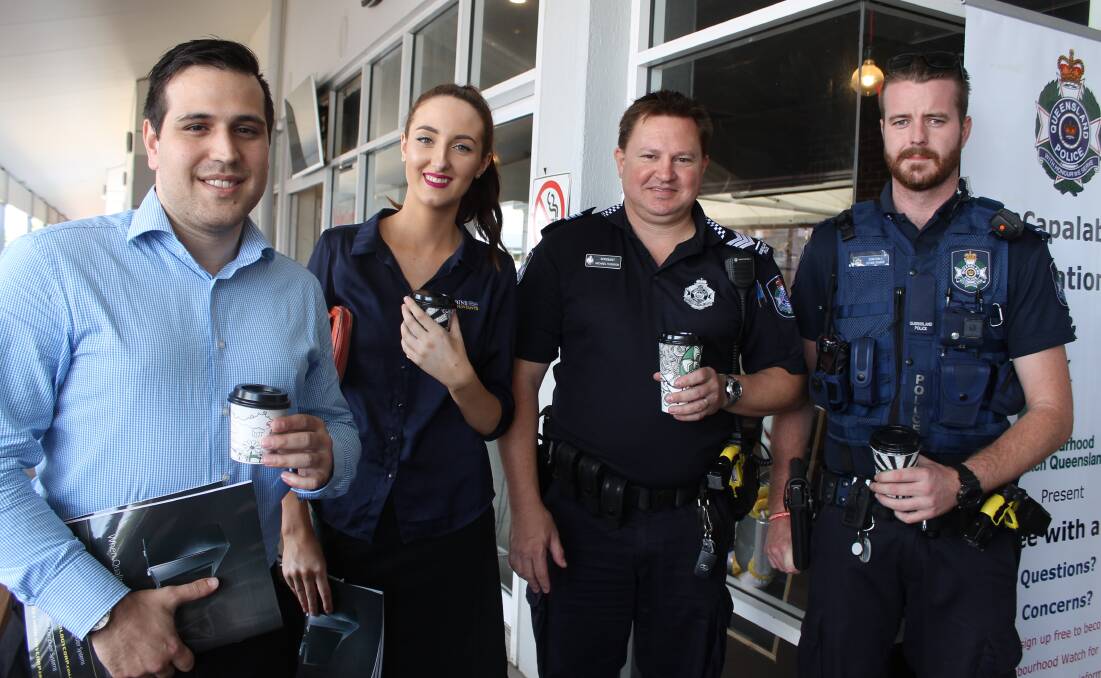 Arun Varma and Hannah McKinnon from Robins Accountants with Sergeant Michael Thomson and Constable Regan O'Hara from Capalaba Police Station. Photo: Cheryl Goodenough