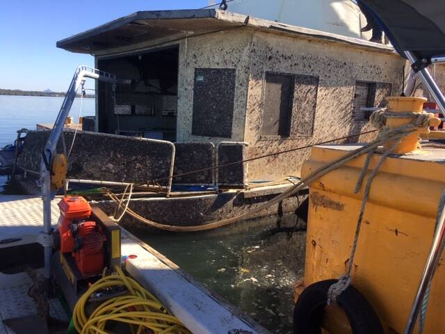 SALVAGED: An abandoned vessel being removed by contractor Maritime Recovery Group. Photo: Marine Recovery Group