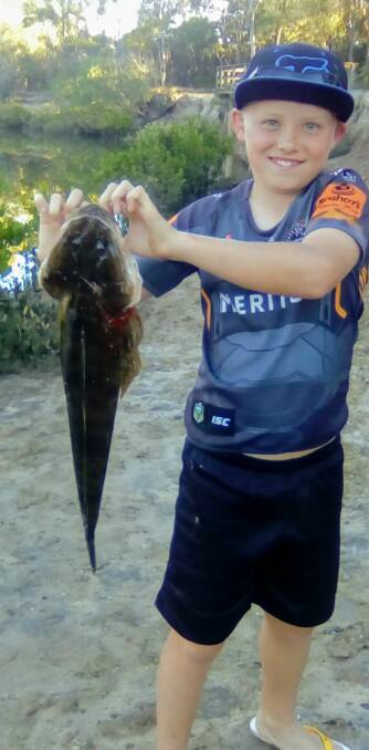LOCAL CATCH: Zachary Baker, 10, of Thornlands, caught this 62 centimetre flathead in Eprapah Creek.