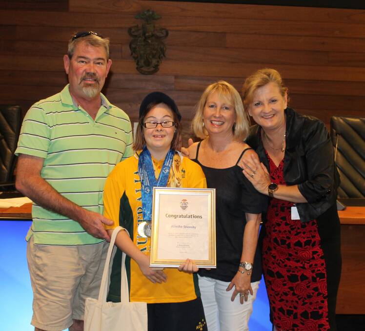 RECOGNITION: David, Aliesha and Carol Sneesby with mayor Karen Williams in the Redland City Council chambers. Photo: Cheryl Goodenough